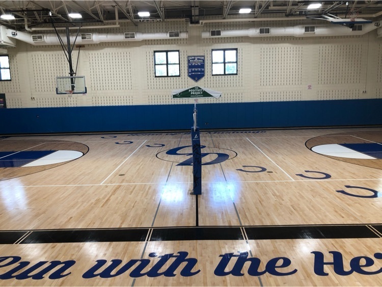 middle school gym floor that reads CD and Run with the herd