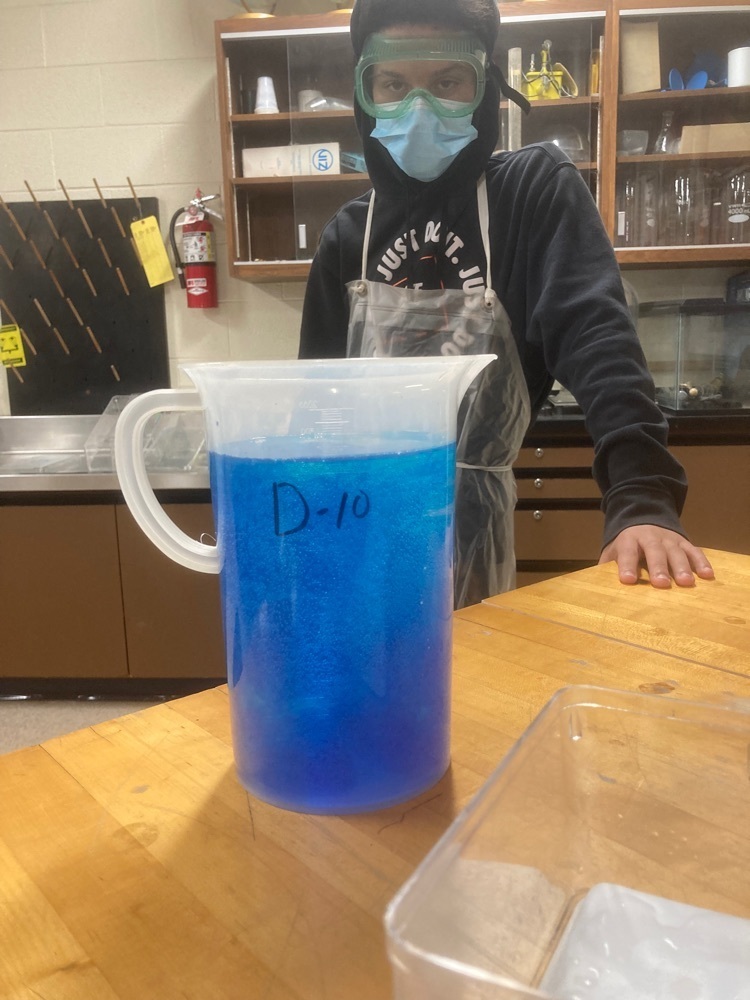 blue beaker of water