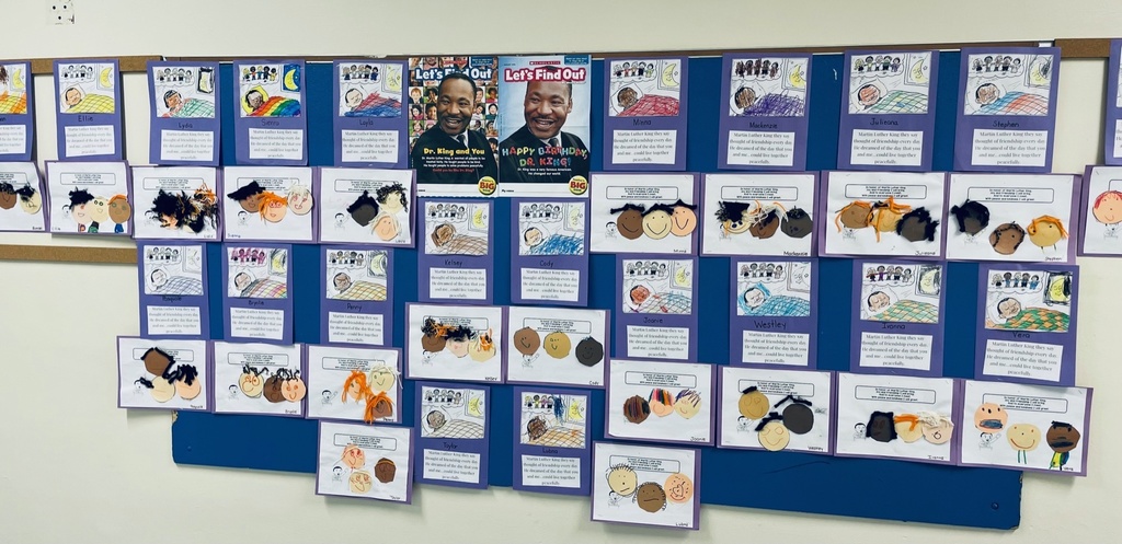bulletin board with photos of Dr. Martin Luther King Jr. and pre-kindergarten drawings