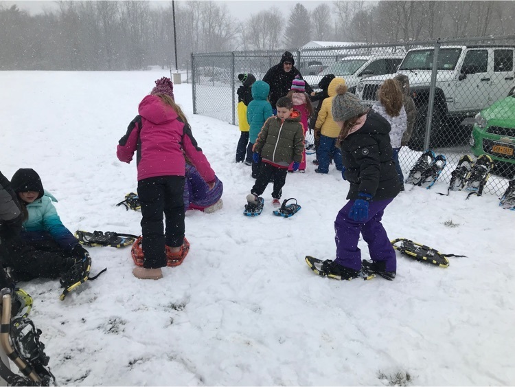 students snow shoeing